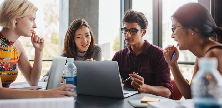 Research experts discussing academic paper structure.